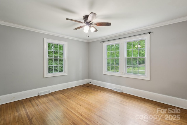 500 Peigler St NW Unit 1 & 2, Concord, NC 28027 - unfurnished room with baseboards, crown molding, a ceiling fan, and wood finished floors