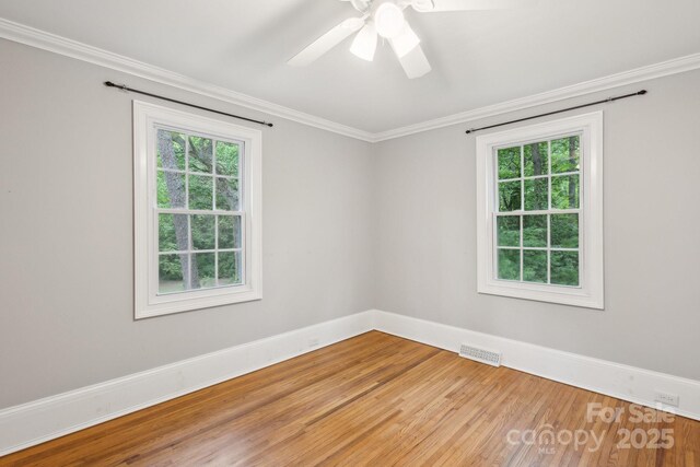 500 Peigler St NW Unit 1 & 2, Concord, NC 28027 - spare room featuring light wood-style flooring, crown molding, ceiling fan, and baseboards