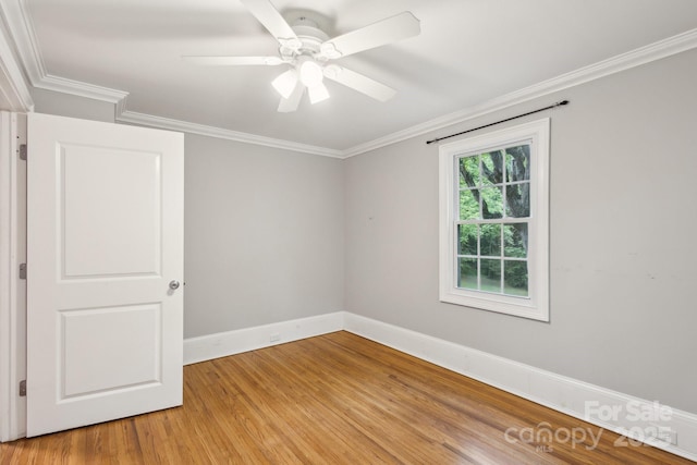 500 Peigler St NW Unit 1 & 2, Concord, NC 28027 - spare room with baseboards, light wood finished floors, crown molding, and ceiling fan