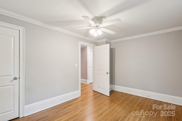 500 Peigler St NW Unit 1 & 2, Concord, NC 28027 - unfurnished bedroom with baseboards, light wood-style floors, crown molding, and a ceiling fan