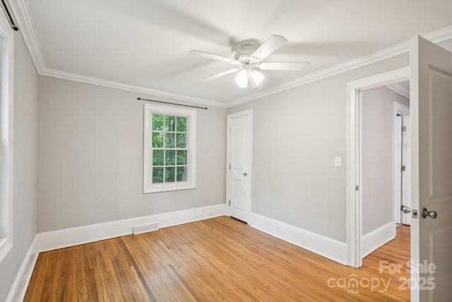 500 Peigler St NW Unit 1 & 2, Concord, NC 28027 - spare room featuring light wood finished floors, ceiling fan, baseboards, and crown molding