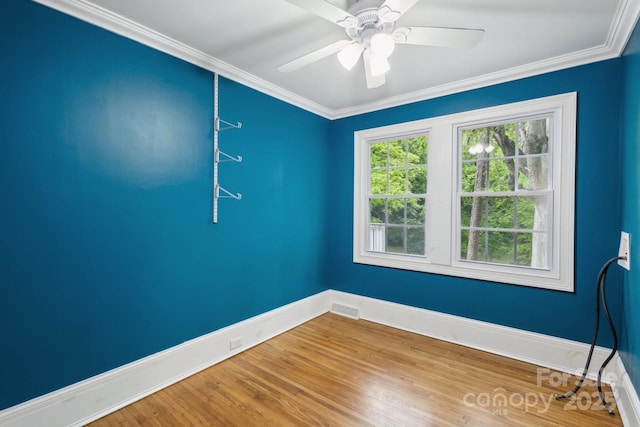 500 Peigler St NW Unit 1 & 2, Concord, NC 28027 - spare room with baseboards, wood finished floors, ornamental molding, and ceiling fan