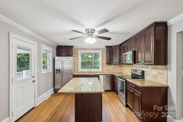 500 Peigler St NW Unit 1 & 2, Concord, NC 28027 - kitchen featuring stainless steel appliances, a sink, a kitchen island, decorative backsplash, and dark brown cabinets