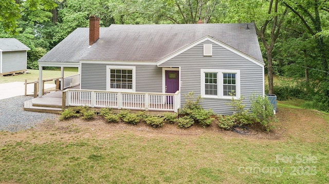500 Peigler St NW Unit 1 & 2, Concord, NC 28027 - view of front of property with a chimney, a front lawn, a deck, and roof with shingles