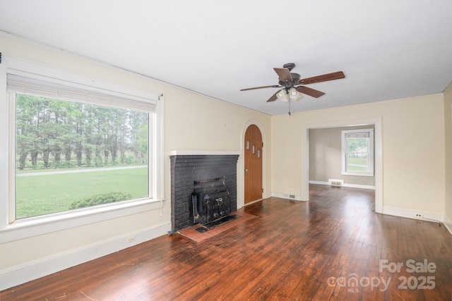 4098 S NC Highway 127, Hickory, NC 28602 - unfurnished living room featuring ceiling fan, plenty of natural light, and wood finished floors