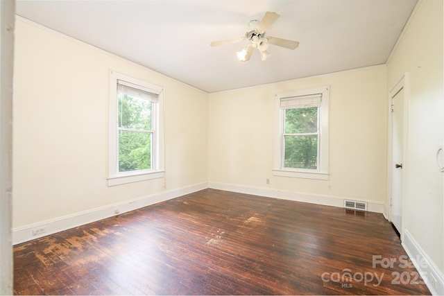 4098 S NC Highway 127, Hickory, NC 28602 - empty room featuring plenty of natural light, dark wood-style flooring, baseboards, ceiling fan, and ornamental molding