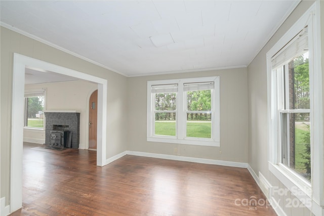 4098 S NC Highway 127, Hickory, NC 28602 - unfurnished living room featuring plenty of natural light, ornamental molding, dark wood-style flooring, and baseboards