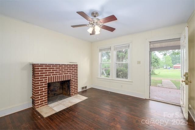4098 S NC Highway 127, Hickory, NC 28602 - unfurnished living room featuring wood-type flooring, a fireplace, ceiling fan, and baseboards