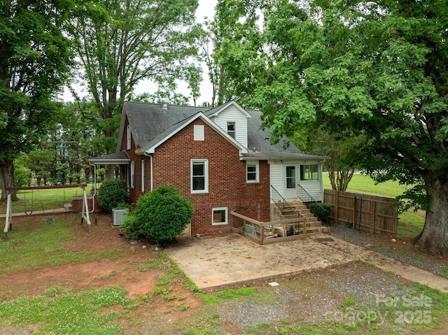 4098 S NC Highway 127, Hickory, NC 28602 - rear view of house featuring brick siding, central AC, a patio area, and a shingled roof