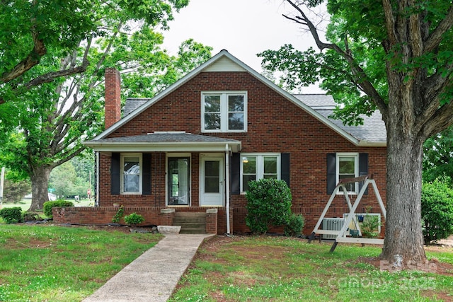 4098 S NC Highway 127, Hickory, NC 28602 - view of front of home with a chimney, roof with shingles, brick siding, and a front lawn