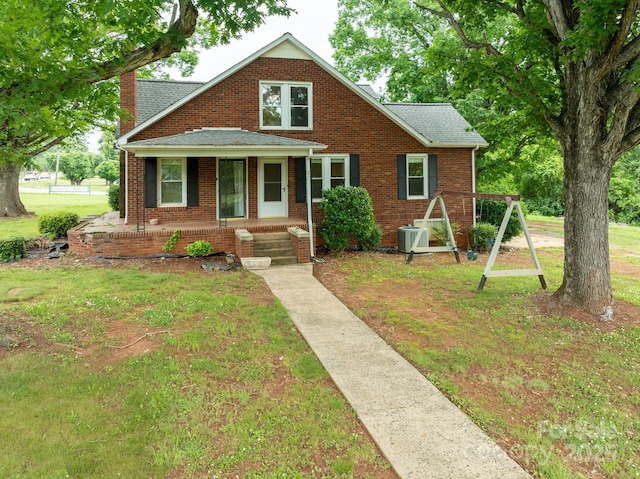 4098 S NC Highway 127, Hickory, NC 28602 - bungalow-style home featuring covered porch, a front yard, a chimney, and roof with shingles