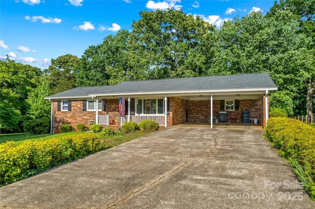 157 E Meadowview Dr, Statesville, NC 28625 - ranch-style house featuring covered porch, brick siding, an attached carport, and concrete driveway