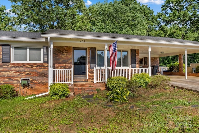 157 E Meadowview Dr, Statesville, NC 28625 - single story home with brick siding, a porch, concrete driveway, and an attached carport