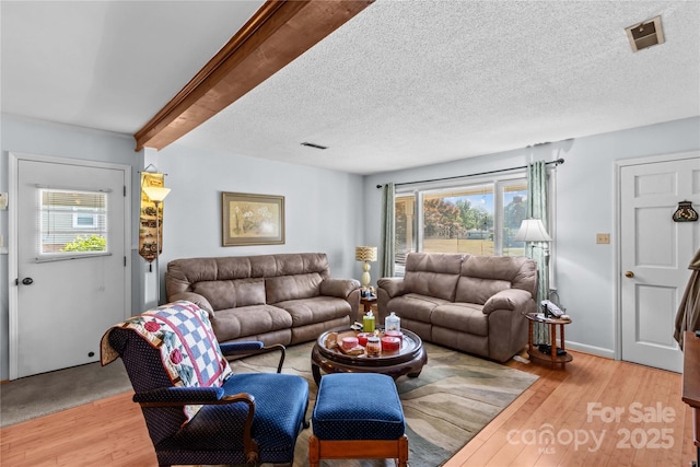 157 E Meadowview Dr, Statesville, NC 28625 - living room featuring plenty of natural light, light wood finished floors, and a textured ceiling