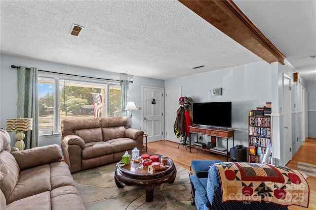 157 E Meadowview Dr, Statesville, NC 28625 - living area featuring wood finished floors and a textured ceiling