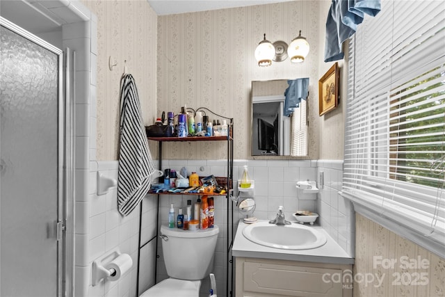 157 E Meadowview Dr, Statesville, NC 28625 - bathroom with wallpapered walls, wainscoting, toilet, vanity, and a shower stall