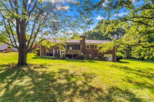 157 E Meadowview Dr, Statesville, NC 28625 - view of grassy yard featuring an attached garage and a sunroom