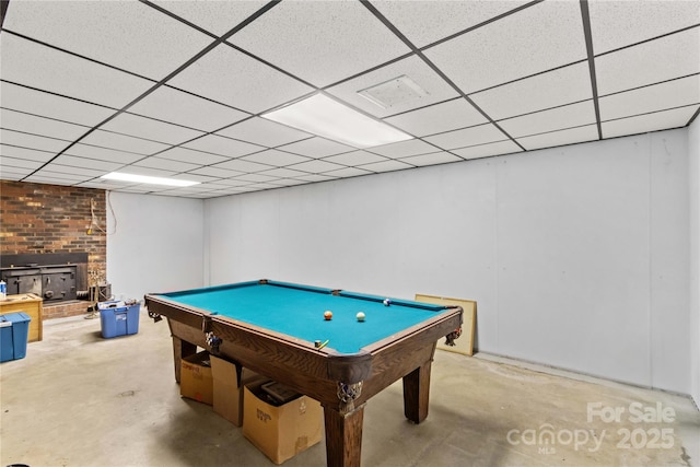 157 E Meadowview Dr, Statesville, NC 28625 - recreation room with concrete floors, billiards, a paneled ceiling, and a wood stove
