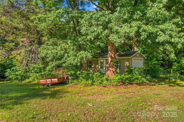 157 E Meadowview Dr, Statesville, NC 28625 - view of green lawn with a garage