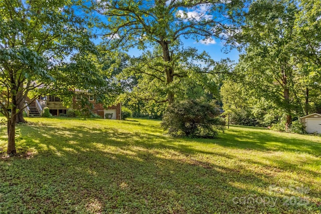 157 E Meadowview Dr, Statesville, NC 28625 - view of grassy yard featuring a deck and stairs