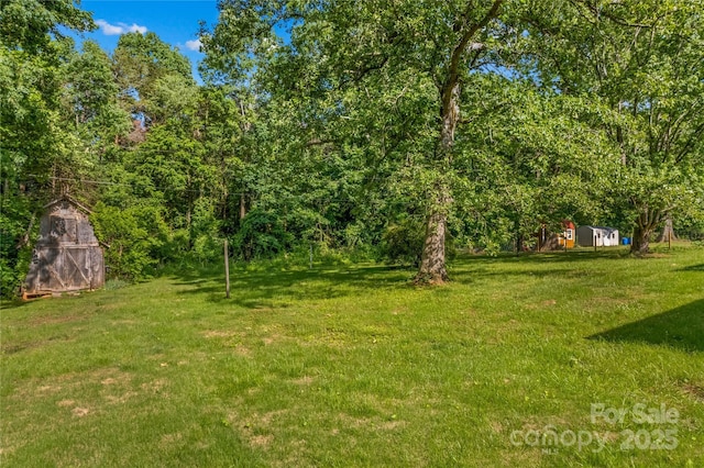 157 E Meadowview Dr, Statesville, NC 28625 - view of grassy yard with a shed and an outdoor structure