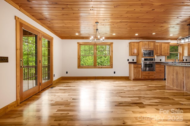 110 Mailon King Rd, Leicester, NC 28748 - kitchen with appliances with stainless steel finishes, healthy amount of natural light, a chandelier, light wood-style flooring, and wood ceiling