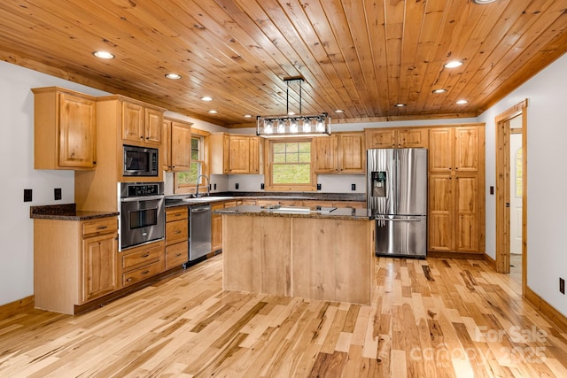 110 Mailon King Rd, Leicester, NC 28748 - kitchen with stainless steel appliances, light wood-style flooring, a sink, recessed lighting, and a kitchen island