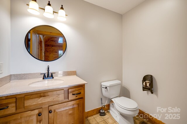 110 Mailon King Rd, Leicester, NC 28748 - bathroom with toilet, baseboards, vanity, and tile patterned flooring