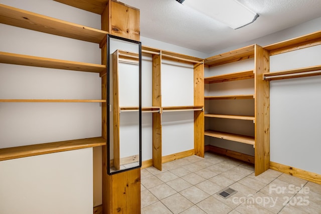 110 Mailon King Rd, Leicester, NC 28748 - spacious closet featuring light tile patterned flooring