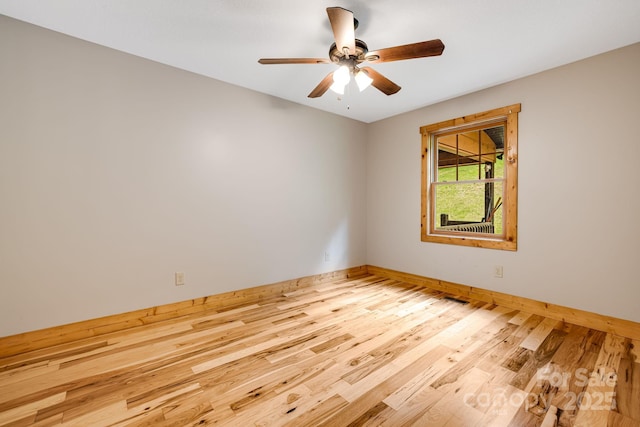 110 Mailon King Rd, Leicester, NC 28748 - spare room with baseboards, wood finished floors, and a ceiling fan