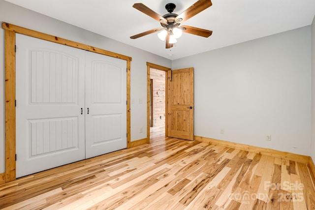 110 Mailon King Rd, Leicester, NC 28748 - unfurnished bedroom featuring baseboards, wood finished floors, a closet, and a ceiling fan