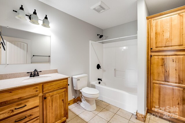 110 Mailon King Rd, Leicester, NC 28748 - bathroom featuring tile patterned floors, toilet, vanity, baseboards, and shower / bath combination
