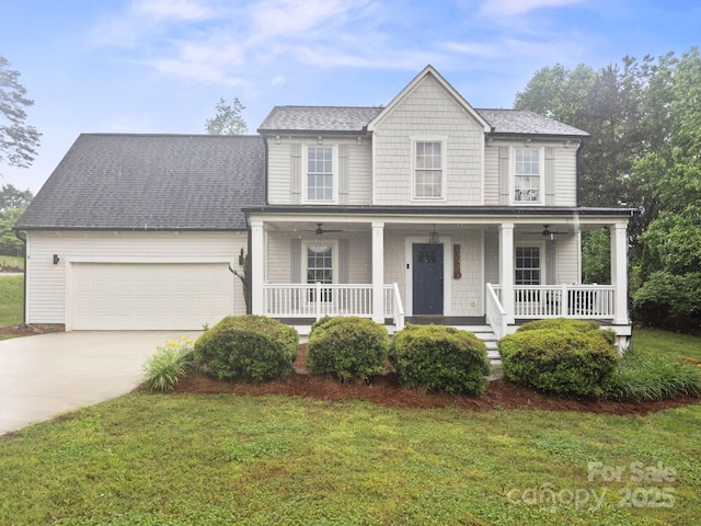 10749 Kingsview Dr, Davidson, NC 28036 - view of front of home featuring an attached garage, driveway, a porch, and a front yard