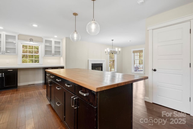 10749 Kingsview Dr, Davidson, NC 28036 - kitchen with butcher block counters, dark wood-style floors, plenty of natural light, white cabinets, and recessed lighting