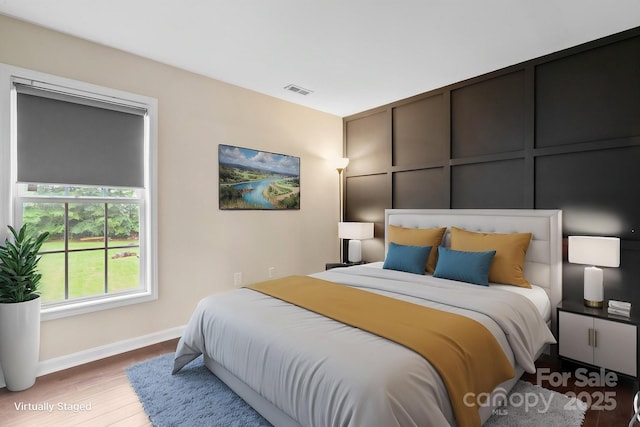 10749 Kingsview Dr, Davidson, NC 28036 - bedroom featuring wood finished floors and baseboards
