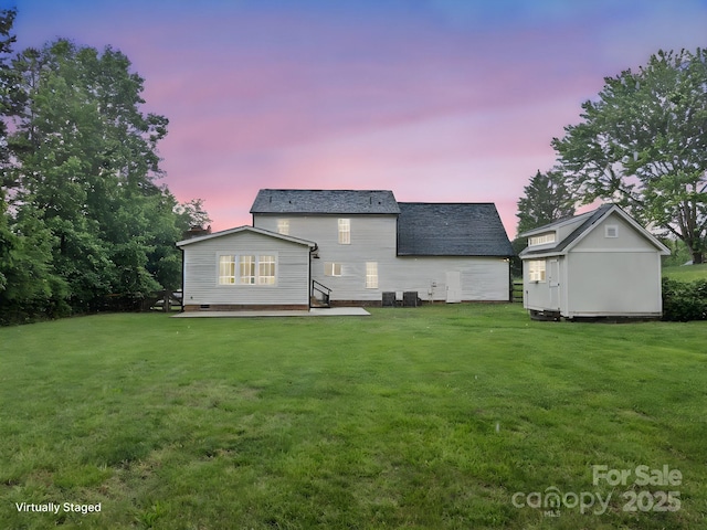 10749 Kingsview Dr, Davidson, NC 28036 - back of house at dusk with a yard