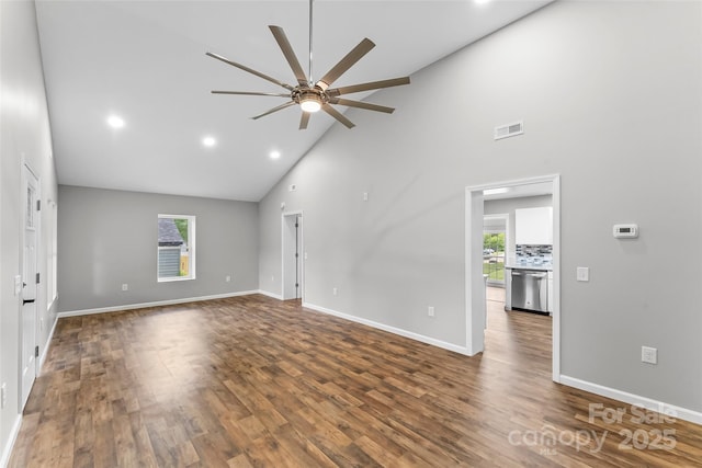 800 Hoyle St SW, Valdese, NC 28690 - unfurnished living room with ceiling fan, high vaulted ceiling, baseboards, dark wood-style floors, and recessed lighting