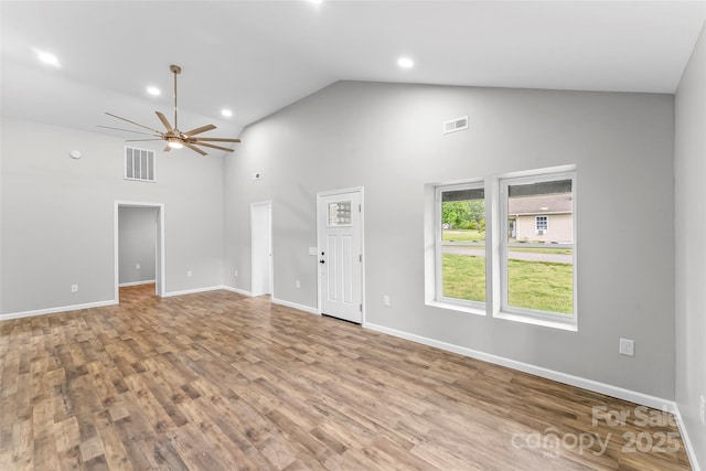 800 Hoyle St SW, Valdese, NC 28690 - unfurnished living room featuring high vaulted ceiling, ceiling fan, wood finished floors, baseboards, and recessed lighting