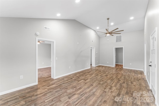 800 Hoyle St SW, Valdese, NC 28690 - unfurnished living room featuring ceiling fan, high vaulted ceiling, wood finished floors, recessed lighting, and baseboards