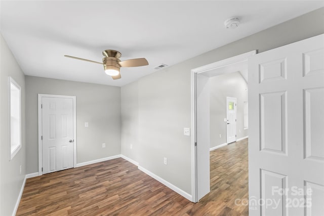 800 Hoyle St SW, Valdese, NC 28690 - empty room featuring wood finished floors, a ceiling fan, baseboards, and a smoke detector