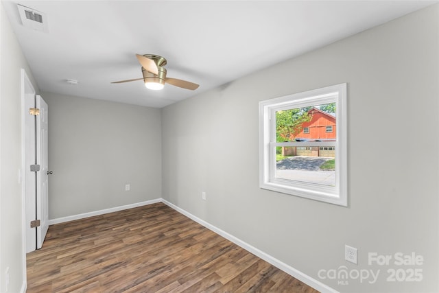 800 Hoyle St SW, Valdese, NC 28690 - unfurnished room featuring wood finished floors, baseboards, ceiling fan, and a smoke detector