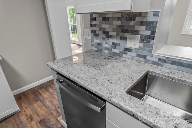 800 Hoyle St SW, Valdese, NC 28690 - kitchen with stainless steel dishwasher, tasteful backsplash, white cabinetry, and a sink