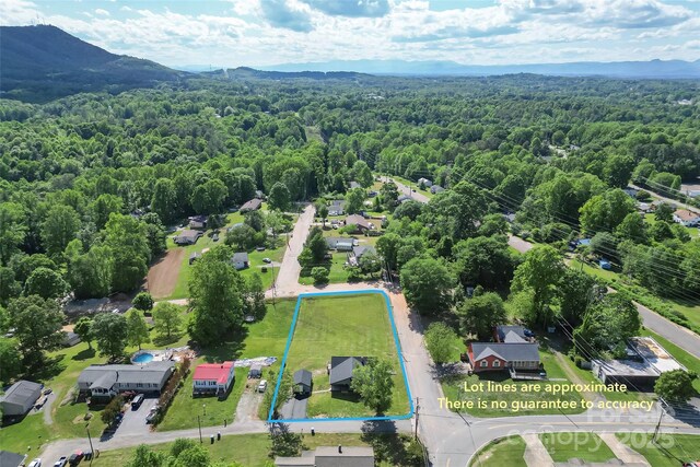 800 Hoyle St SW, Valdese, NC 28690 - view of property location with a forest, property parcel outlined, and a mountainous background