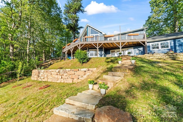 84 Halfmoon Way, Clyde, NC 28721 - rear view of house with a wooden deck, stairway, and a yard