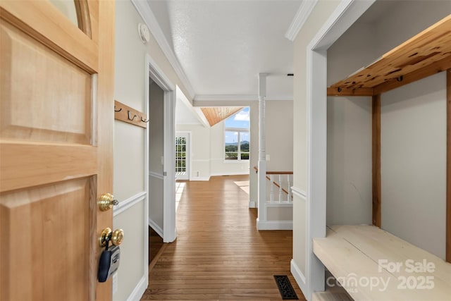 84 Halfmoon Way, Clyde, NC 28721 - mudroom featuring wood finished floors and ornamental molding