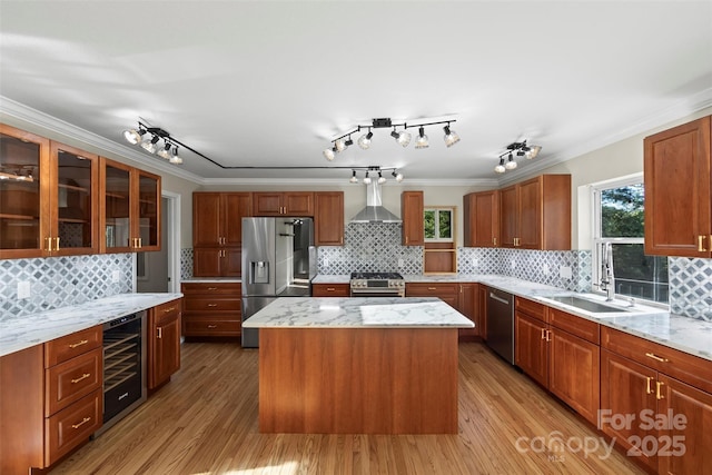 84 Halfmoon Way, Clyde, NC 28721 - kitchen featuring appliances with stainless steel finishes, beverage cooler, a sink, decorative backsplash, and crown molding