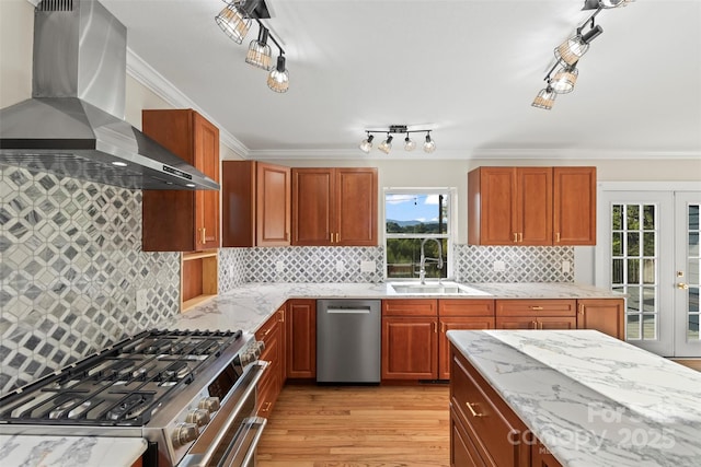 84 Halfmoon Way, Clyde, NC 28721 - kitchen with wall chimney range hood, appliances with stainless steel finishes, a sink, ornamental molding, and light stone counters
