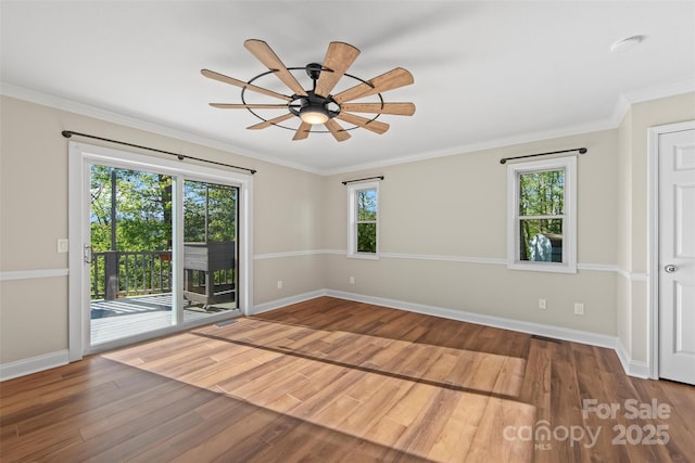 84 Halfmoon Way, Clyde, NC 28721 - empty room with baseboards, wood finished floors, ceiling fan, and ornamental molding