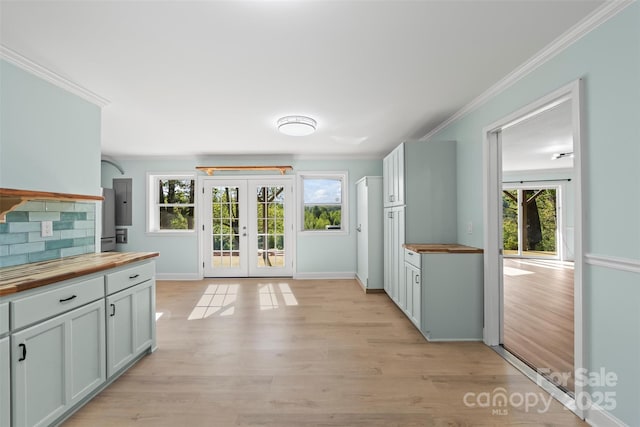 84 Halfmoon Way, Clyde, NC 28721 - kitchen featuring wood counters, french doors, healthy amount of natural light, crown molding, and light wood-style flooring