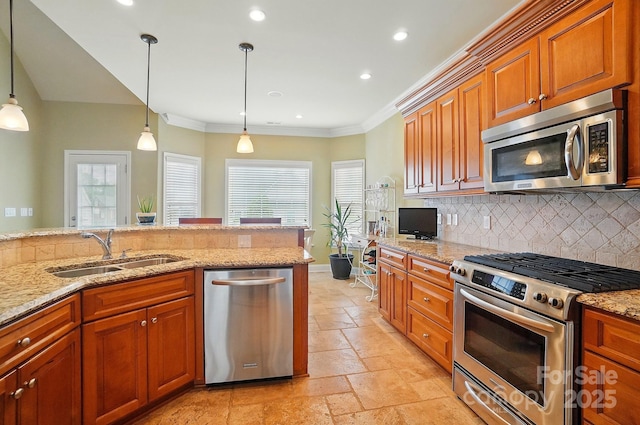 129 Daniel Efird Dr, Mount Holly, NC 28120 - kitchen featuring appliances with stainless steel finishes, a sink, stone tile floors, tasteful backsplash, and crown molding